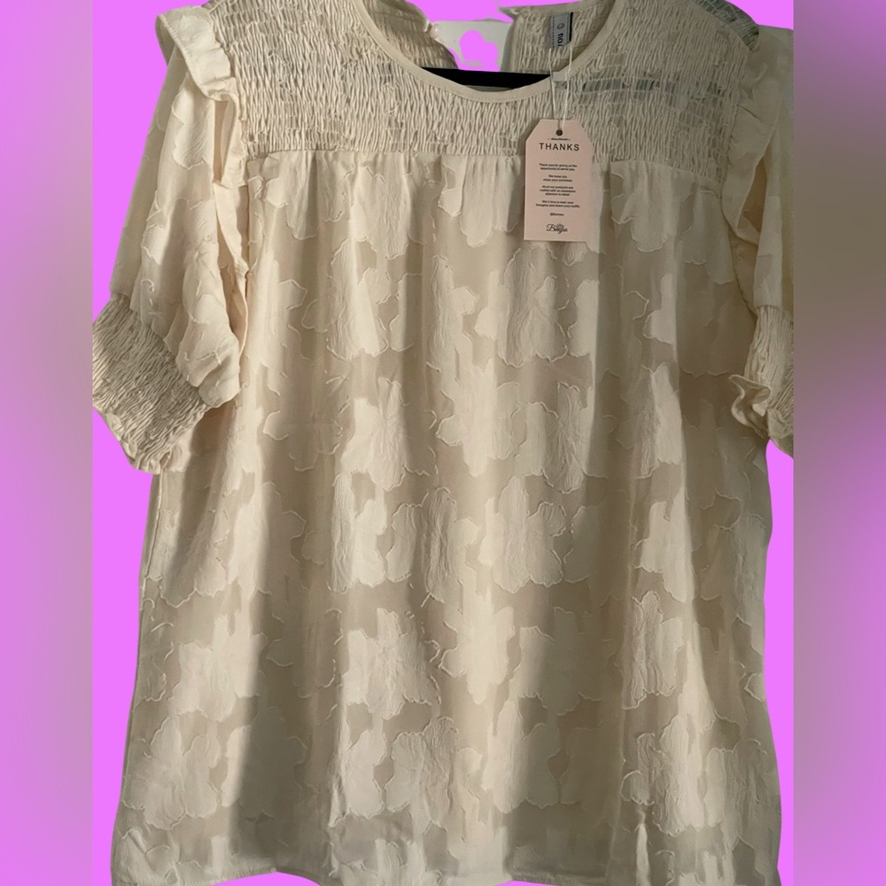 Cream colored puff sleeved blouse